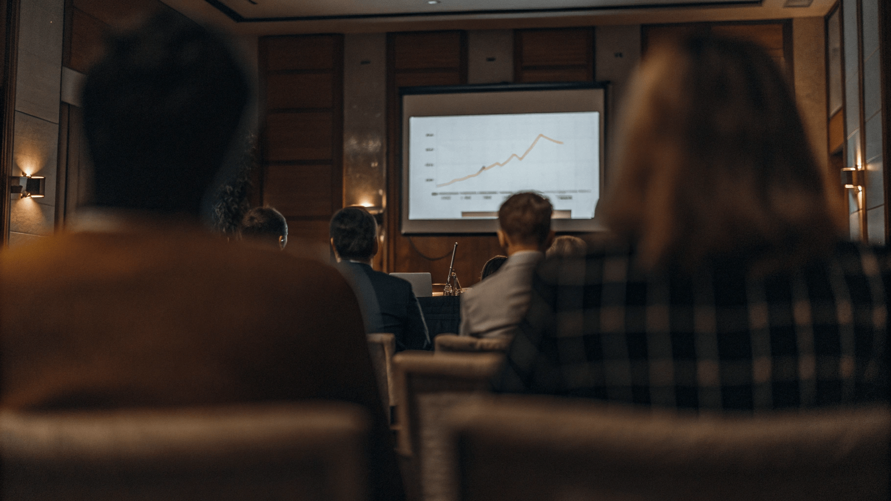 a group of watching a presentation on a screen set smart goals