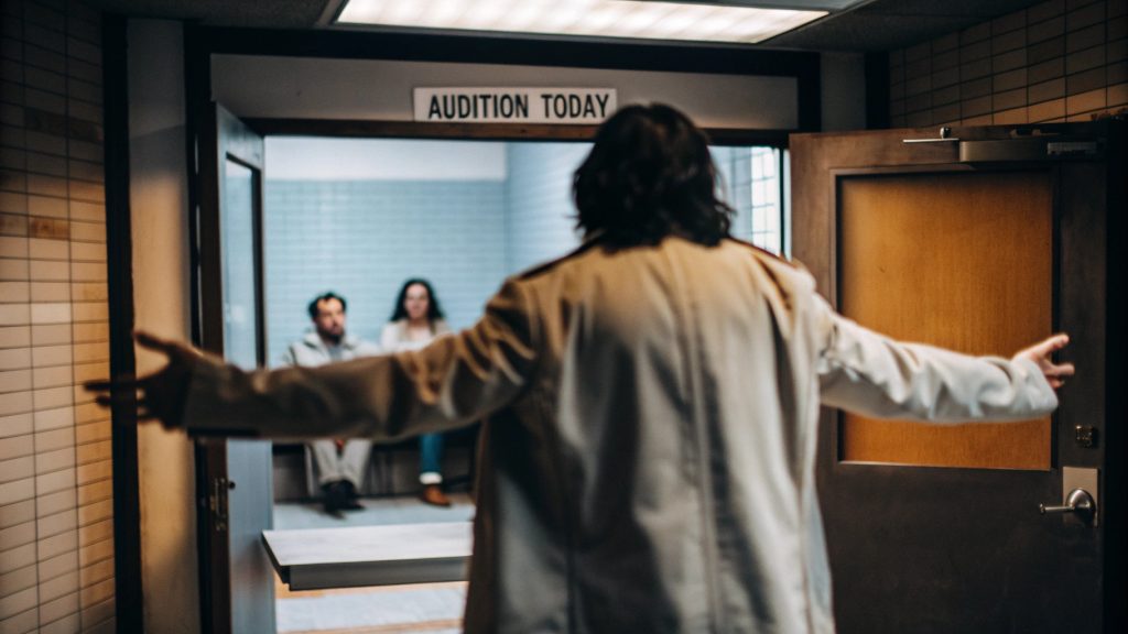 An actor with a confident audition mindset entering the audition room with no audition anxiety