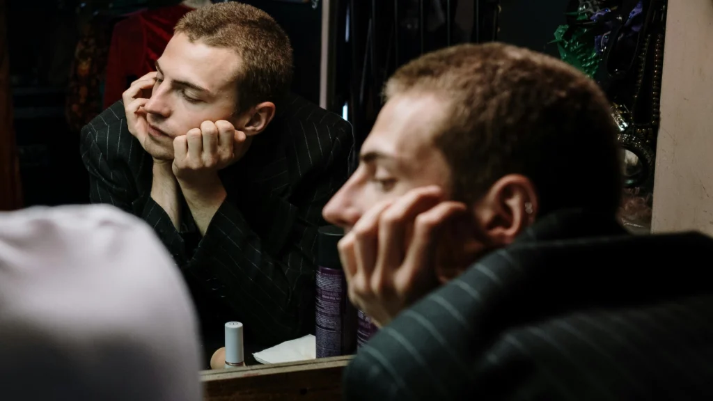 An actor leaving the stage facing audition rejection