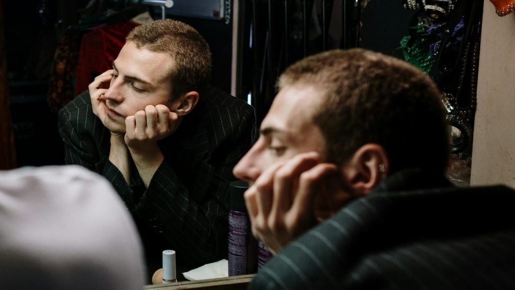 An actor leaving the stage facing audition rejection